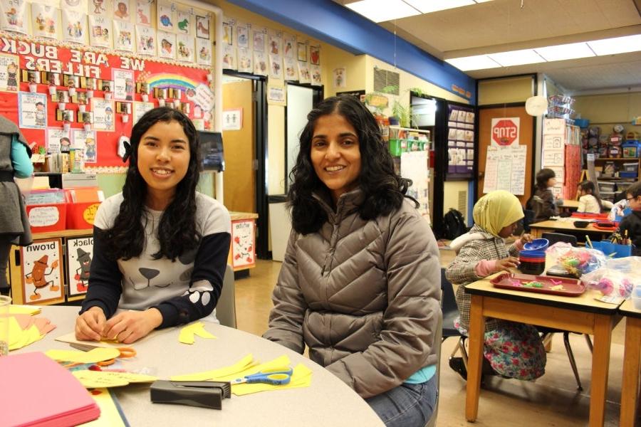 Reny Mathan (left) and Melissa Bean volunteer weekly at James Baldwin Elementary as tutors and classroom helpers in Mrs. Mulder’s Kindergarten Classroom.